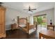 Spacious bedroom with a ceiling fan, hardwood floors, and sliding glass doors to the back patio at 1444 Whitney Isles Dr, Windermere, FL 34786