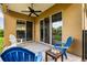 Covered patio with chairs and a ceiling fan showcasing seamless indoor-outdoor living at 1444 Whitney Isles Dr, Windermere, FL 34786