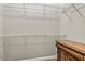 Walk-in closet featuring wire shelving with a view of a dark wood dresser at 1444 Whitney Isles Dr, Windermere, FL 34786
