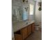 Bathroom featuring a single sink, and decorative accents above the toilet at 149 Roseling Xing, Davenport, FL 33897