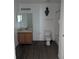 Bathroom with a large mirror and a wooden vanity with ample counter space at 149 Roseling Xing, Davenport, FL 33897