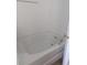 Bathtub with tile surround and chrome hardware in the bathroom at 149 Roseling Xing, Davenport, FL 33897