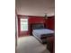 Bedroom showcasing a window with red walls, carpeted floor and a ceiling fan at 149 Roseling Xing, Davenport, FL 33897