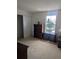 Bright bedroom featuring neutral walls, carpet, a window, and ample closet space at 149 Roseling Xing, Davenport, FL 33897