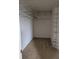 Walk-in closet with installed shelving for optimal organization and storage at 149 Roseling Xing, Davenport, FL 33897
