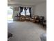 Cozy living room with comfortable seating and natural light streaming through the window at 149 Roseling Xing, Davenport, FL 33897
