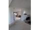 Open-concept living area featuring neutral walls and multiple seating areas at 149 Roseling Xing, Davenport, FL 33897