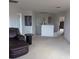 Upstairs loft featuring carpeted floors, leather sofa and chandelier at 149 Roseling Xing, Davenport, FL 33897
