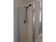 Shower stall with glass doors and silver hardware in tiled surround at 149 Roseling Xing, Davenport, FL 33897