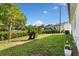 Lush backyard with manicured lawn and garden views, perfect for outdoor enjoyment at 16615 Oklahoma St, Clermont, FL 34715