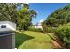 Spacious backyard with lush greenery and trees creating a serene outdoor setting at 16615 Oklahoma St, Clermont, FL 34715