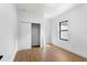 This light, bright bedroom features wood floors, closet, and white trim at 16615 Oklahoma St, Clermont, FL 34715
