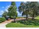 Community view featuring waterfront boardwalk, park, trees, and shade at 16615 Oklahoma St, Clermont, FL 34715