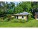 Exterior view of house in need of repair at 16615 Oklahoma St, Clermont, FL 34715