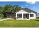 This inviting property features a well-manicured lawn and a detached garage, offering both curb appeal and practicality at 16615 Oklahoma St, Clermont, FL 34715