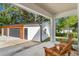 Spacious garage with wood and white siding, offering ample parking and storage at 16615 Oklahoma St, Clermont, FL 34715