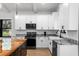 Kitchen featuring granite countertops, stainless appliances, and island at 16615 Oklahoma St, Clermont, FL 34715