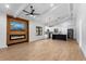 Open concept living space featuring a kitchen, fireplace, and mounted TV at 16615 Oklahoma St, Clermont, FL 34715