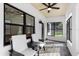 Cozy porch features seating and views to the outside at 16615 Oklahoma St, Clermont, FL 34715