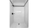 Tiled shower featuring white tiles and matte black hardware at 16615 Oklahoma St, Clermont, FL 34715