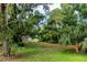 This property features mature trees and open spaces, creating a serene setting at 16615 Oklahoma St, Clermont, FL 34715