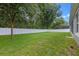 Expansive backyard featuring lush green grass and a privacy fence at 1702 Hoofprint Ct, Fruitland Park, FL 34731
