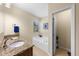 Bathroom with double vanity, bathtub, and a separate toilet at 1702 Hoofprint Ct, Fruitland Park, FL 34731