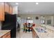 Bright kitchen featuring granite countertops, stainless steel appliances, and a breakfast nook at 1702 Hoofprint Ct, Fruitland Park, FL 34731