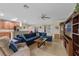 Open-concept living room featuring tile floors, with views into the kitchen and dining areas at 1702 Hoofprint Ct, Fruitland Park, FL 34731