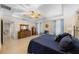 Main bedroom with tiled flooring, a fan, and wooden furniture at 1702 Hoofprint Ct, Fruitland Park, FL 34731