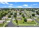 An aerial view showcasing the property's location within a well-established community with tree-lined streets at 1892 Sanderling Dr, Clermont, FL 34711