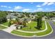 A beautiful aerial view of the home surrounded by mature landscaping and a well manicured lawn at 1892 Sanderling Dr, Clermont, FL 34711