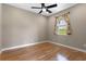 Bright bedroom with hardwood floors and a window that provides natural light at 1892 Sanderling Dr, Clermont, FL 34711