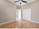 Simple bedroom with hardwood floors and a closet for storage at 1892 Sanderling Dr, Clermont, FL 34711