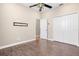 This room features hardwood flooring, a ceiling fan, and closet—ready for your personal touches at 1892 Sanderling Dr, Clermont, FL 34711