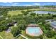 The sparkling community pool and surrounding landscape makes a refreshing haven for relaxation and recreation at 1892 Sanderling Dr, Clermont, FL 34711