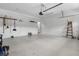 Spacious garage offering ample room for vehicles and storage, equipped with organizational tools at 1892 Sanderling Dr, Clermont, FL 34711