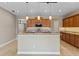 Spacious kitchen with granite countertops, stainless steel appliances, and a central island at 1892 Sanderling Dr, Clermont, FL 34711