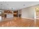 Open concept living space leading into a kitchen featuring stainless appliances and wooden cabinetry at 1892 Sanderling Dr, Clermont, FL 34711