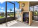 Screened-in porch featuring a stainless steel outdoor grill and cooking area for outdoor dining and entertaining at 1892 Sanderling Dr, Clermont, FL 34711