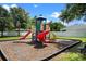A cheerful community playground offers climbing, sliding, and interactive elements in a secure, fun environment at 1892 Sanderling Dr, Clermont, FL 34711