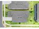 Aerial shot of two neighboring homes displaying the roof, lawn, and driveways at 2161 Gold Dust Dr, Minneola, FL 34715