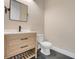Well-lit half bath features a modern vanity and sleek fixtures at 2161 Gold Dust Dr, Minneola, FL 34715
