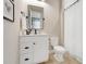 Bright bathroom featuring a vanity with drawers, a toilet and a mirror at 2161 Gold Dust Dr, Minneola, FL 34715