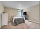 Neutral bedroom featuring a bed, a TV, and a large window at 2161 Gold Dust Dr, Minneola, FL 34715