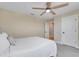 A spacious bedroom featuring neutral walls, carpet flooring, a ceiling fan and a closed closet door at 2161 Gold Dust Dr, Minneola, FL 34715