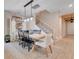 Open concept dining room has rustic lighting, tile floors, and is adjacent to the entry hall at 2161 Gold Dust Dr, Minneola, FL 34715