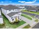 A two-story home that is well-landscaped with a covered front porch at 2161 Gold Dust Dr, Minneola, FL 34715