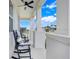 Covered front porch with white columns and comfortable seating creating an inviting outdoor space at 2161 Gold Dust Dr, Minneola, FL 34715