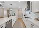 Well-appointed kitchen featuring white cabinetry, stainless steel appliances, an island, and seamless design at 2161 Gold Dust Dr, Minneola, FL 34715